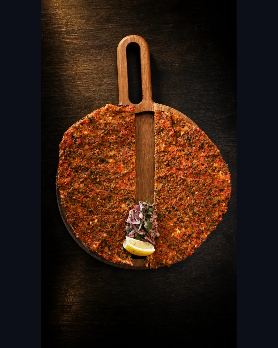 Lahmacun on a wooden serving board