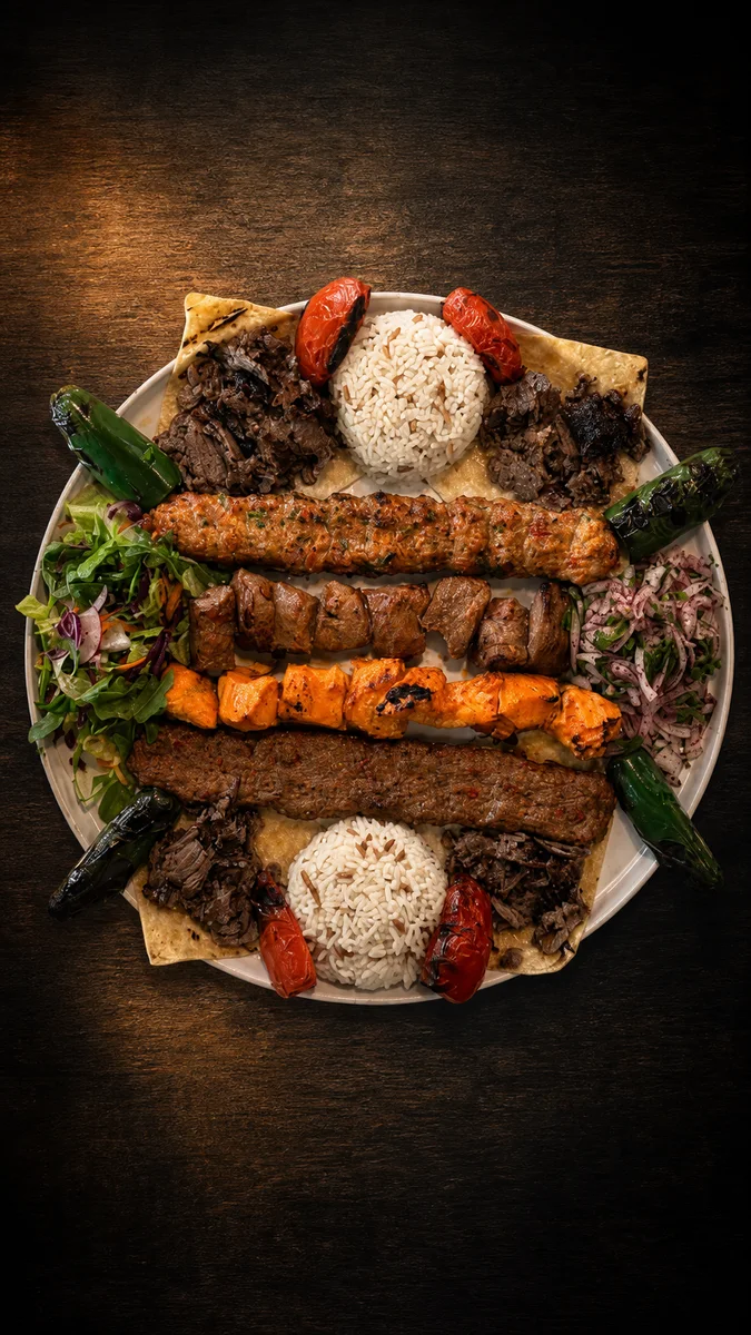 Mix grill platter with adana kebab, chicken shish, döner, rice and salad